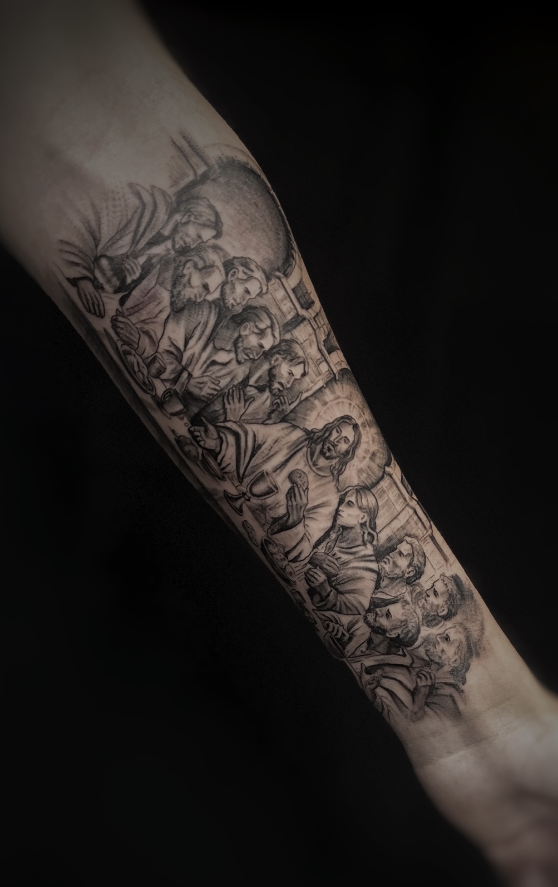 Religious realism sleeve tattoo